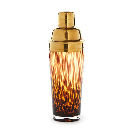 Glass cocktail shaker with a brown tortoise print pattern and a polished gold stainless steel lid.