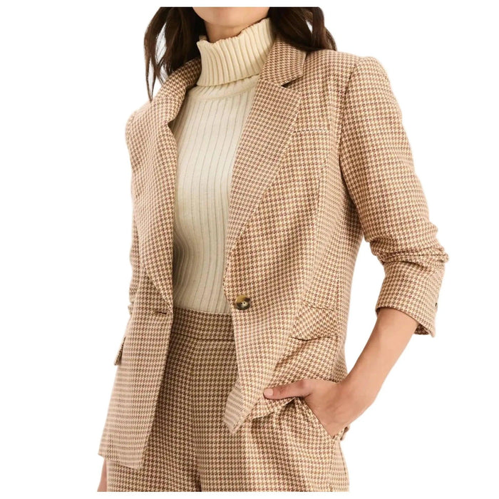 Tan and brown houndstooth blazer with a lapel collar, single-button closure, and ruched three-quarter sleeves.