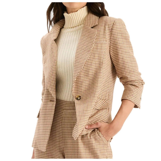 Tan and brown houndstooth blazer with a lapel collar, single-button closure, and ruched three-quarter sleeves.