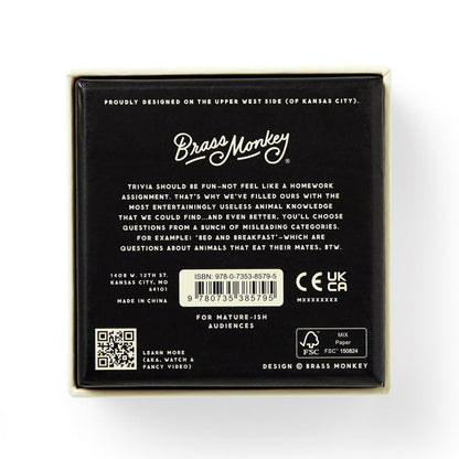 The back of the Useless Animal Trivia by Brass Monkey features the logo, a quirky game description, barcode, age and safety icons, plus location info—all in white text on a black background.