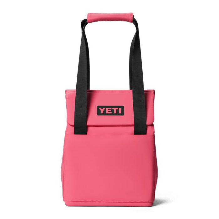 YETI Daytrip 14L insulated tote in bright pink with black straps, MagSnap closure, and front YETI logo patch.