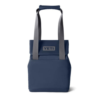 Navy blue YETI Daytrip 14L insulated tote bag with gray straps, MagSnap closure, and front logo patch on a white background.