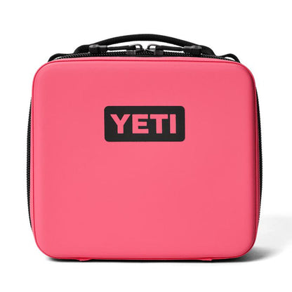 Bright pink YETI Daytrip 3L insulated lunch box with a black logo, rugged water-resistant shell, and top carry handle.