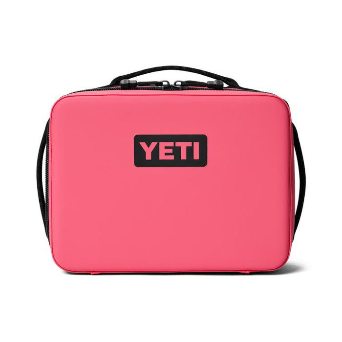 Bright pink YETI Daytrip 5L insulated lunch box with a black logo, top handle, and durable water-resistant exterior.