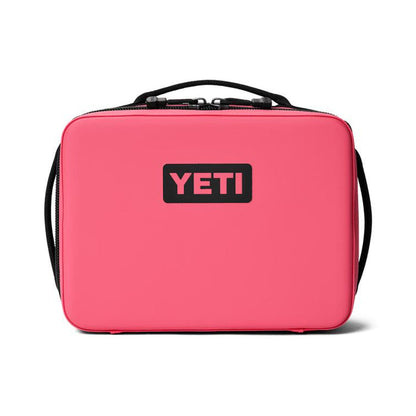 Bright pink YETI Daytrip 5L insulated lunch box with a black logo, top handle, and durable water-resistant exterior.