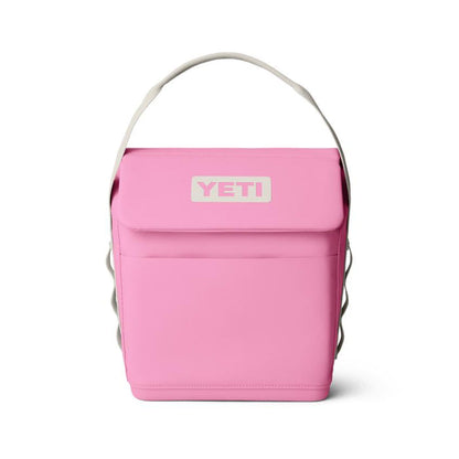 Pink YETI Daytrip 6L insulated lunch bag with a top handle, magnetic closure, and front pocket on a white background.
