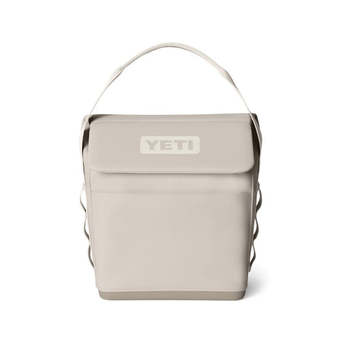 Beige YETI Daytrip 6L insulated lunch bag with a structured upright design, top handle, and secure MagSnap closure.