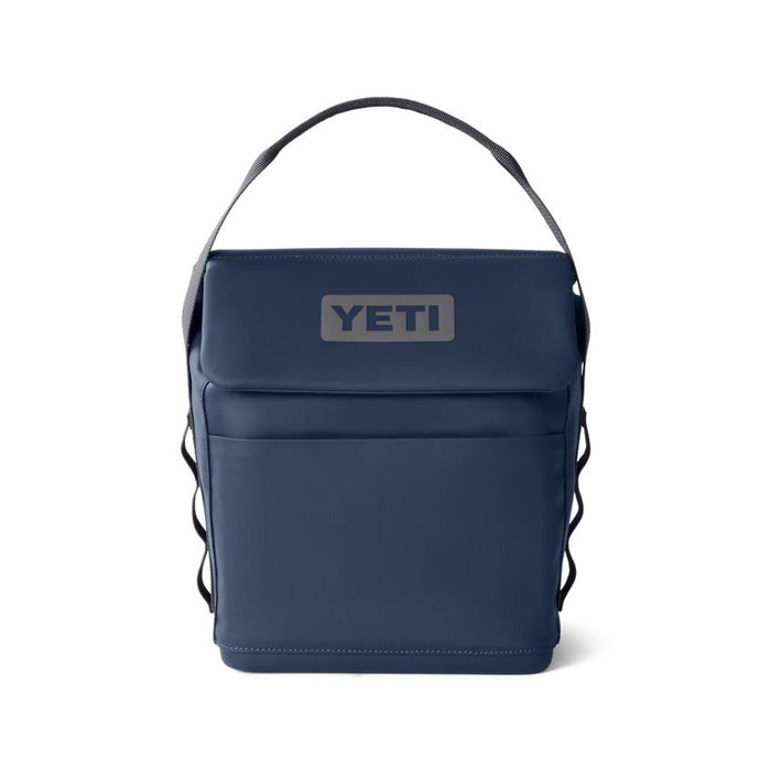 Navy blue YETI Daytrip 6L insulated lunch bag with a top handle, MagSnap closure, and front pocket on a white background.