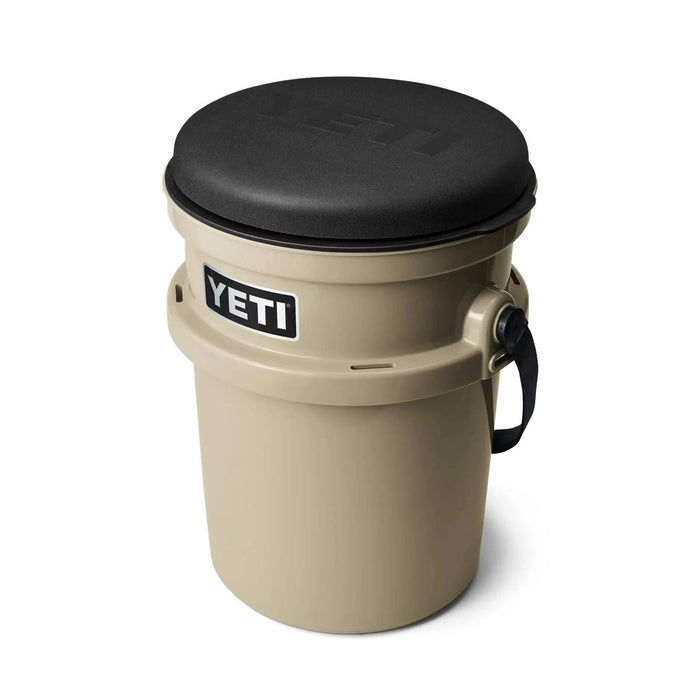 Tan YETI LoadOut bucket with a black padded 360-degree swivel seat lid attached.