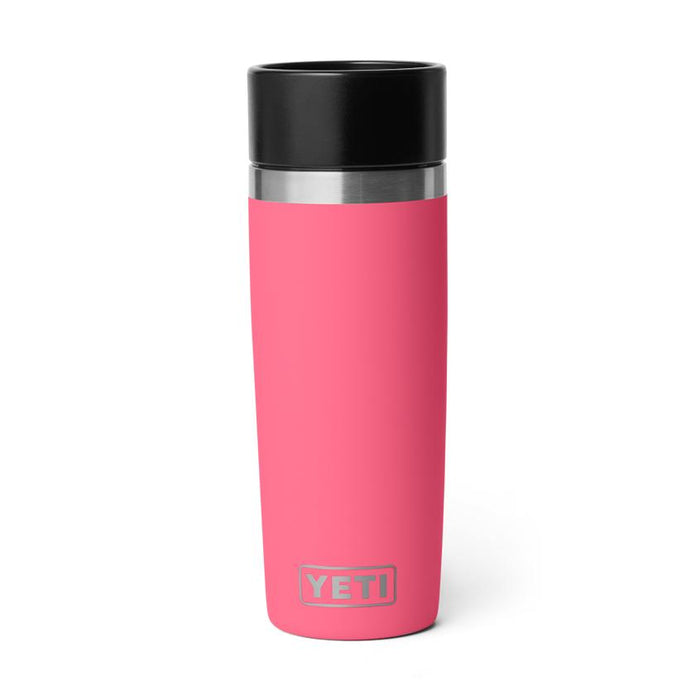 Hot pink 16 oz Yeti Rambler travel bottle with a black leakproof commuter cap and stainless steel logo detail.