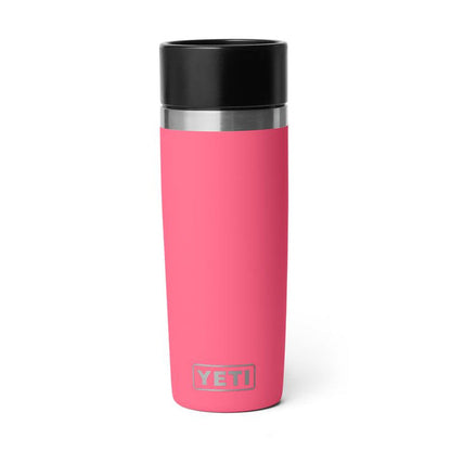 Hot pink 16 oz Yeti Rambler travel bottle with a black leakproof commuter cap and stainless steel logo detail.