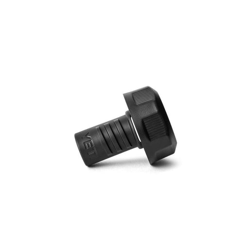 Black YETI BestDam leakproof drain plug with a textured, screw-top cap and grooved stem for Roadie coolers.