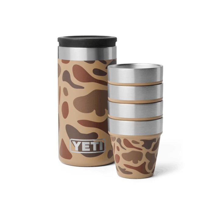 YETI stainless steel shot glass set in tan camo print with a matching stackable carrying case on a white background.