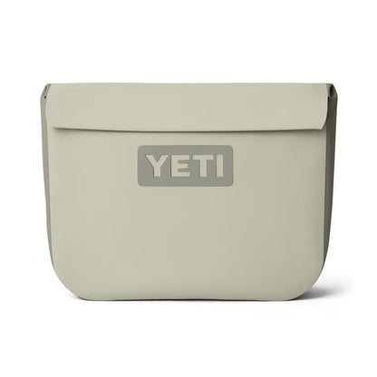 YETI Sidekick Dry 6L waterproof gear case in tan featuring a magnetic closure and durable RF-welded seams.