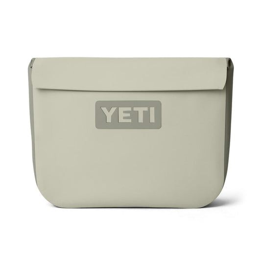 YETI Sidekick Dry 6L waterproof gear case in tan featuring a magnetic closure and durable RF-welded seams.