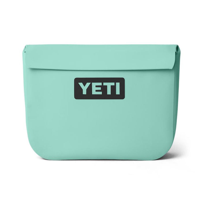 YETI Sidekick Dry 6L gear case in light green with a waterproof magnetic seal and black logo patch on a white background.