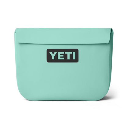 YETI Sidekick Dry 6L gear case in light green with a waterproof magnetic seal and black logo patch on a white background.