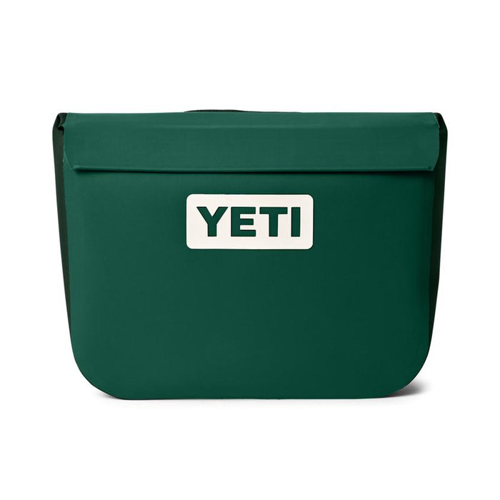 YETI Sidekick Dry 6L gear case in dark green with a waterproof magnetic seal and white brand logo on the front.