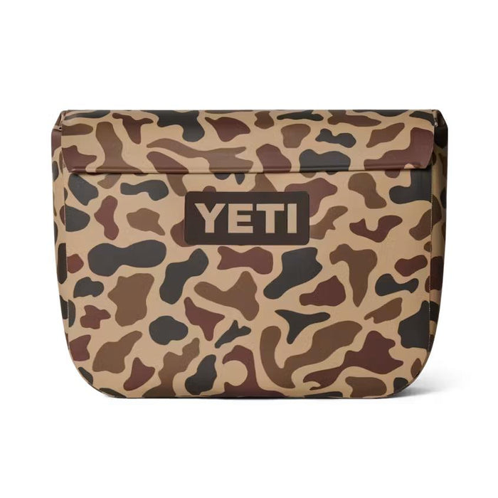 YETI Sidekick Dry 6L gear case in brown camo print with a waterproof magnetic closure and durable RF-welded seams.
