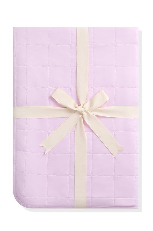Youth Blanket in Thistle 1.0 shown in its packaging tied in a linen bow